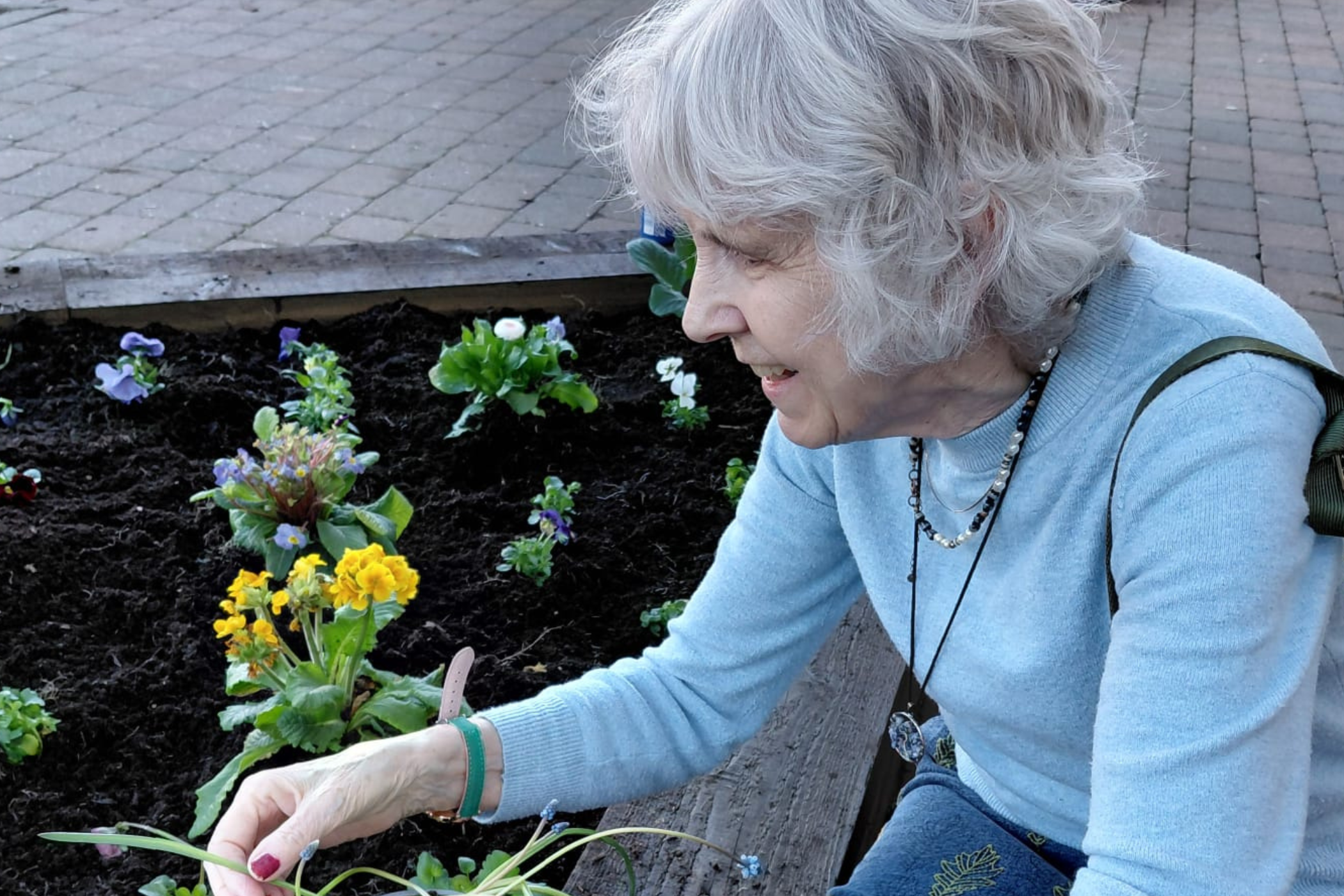 Residents working on flower beds