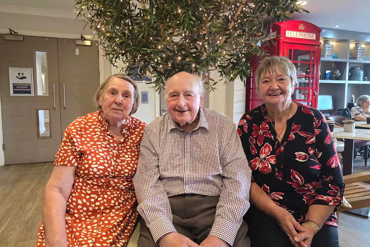 nesbit house care home residents sat in care home next to tree