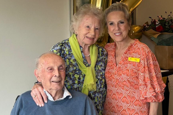 Residents with Home Manager for Anniversary Celebration