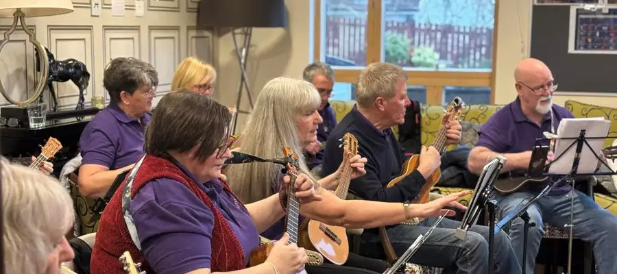Strings of Joy: Newton House Residents Celebrate Ukulele Day in Style! 